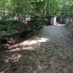 A bridge in a wooded area.
